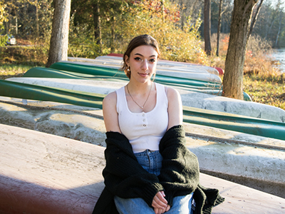 Girl sitting in forest