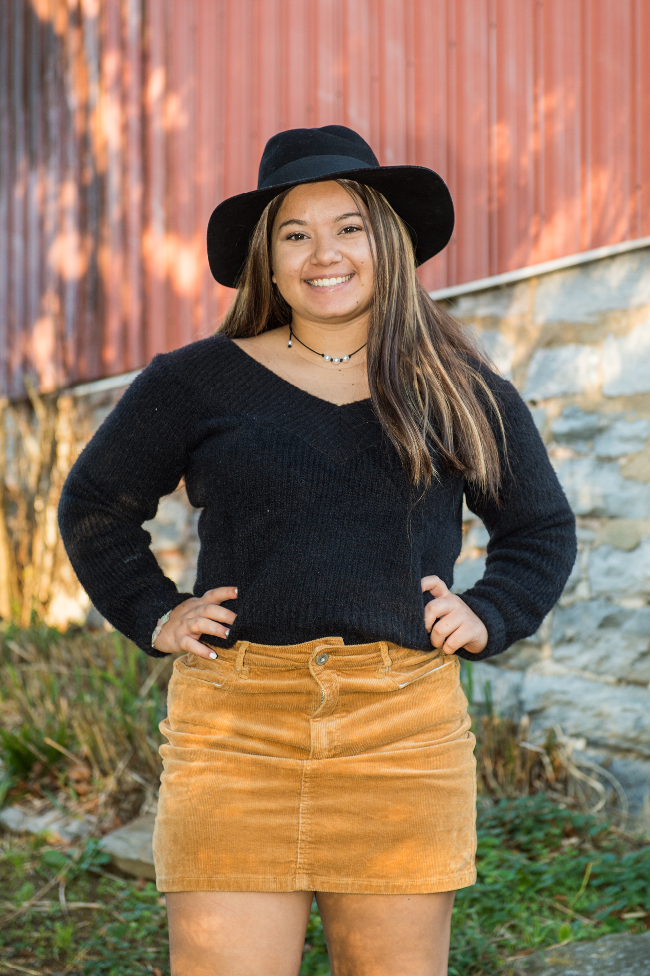 Girl posing with hands on hips